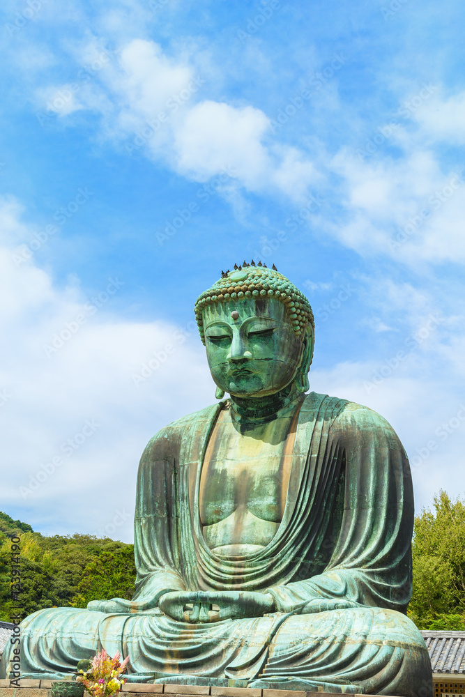 The Great Buddha in Kamakura Japan. Located in Kamakura, Kanagawa Prefecture Japan.There are pigeon to Buddha's head. The Great Buddha in Kamakura Japan. Located in Kamakura, Kanagawa Prefecture Japan.There are pigeon to Buddha's head.