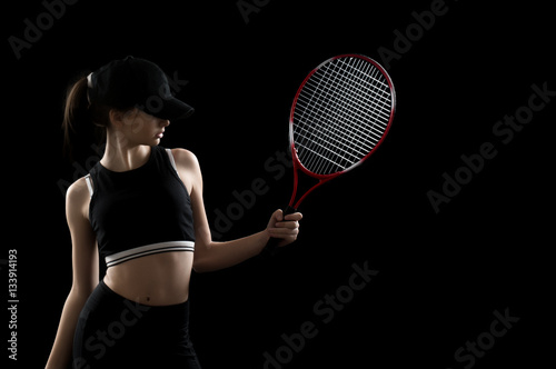 Portrait of sporty teen girl tennis player with racket