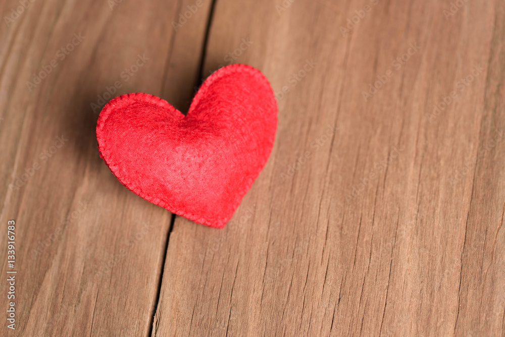 Valentines day concept of one heart shape decoration with old wood floor background. Valentines day concept of one heart shape decoration with old wood floor background.