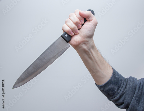 big kitchen knife in man hand