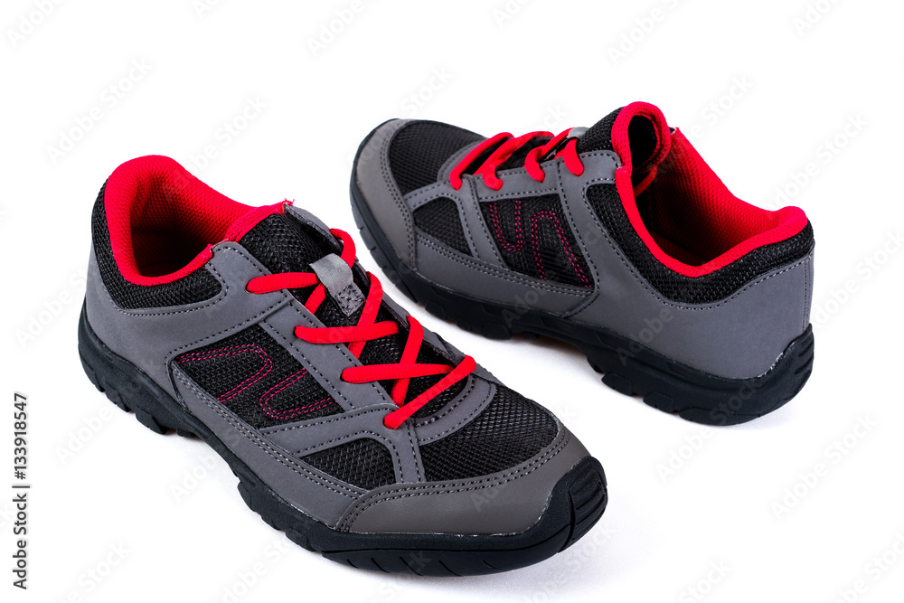 gray and pink children's sneakers on a white background