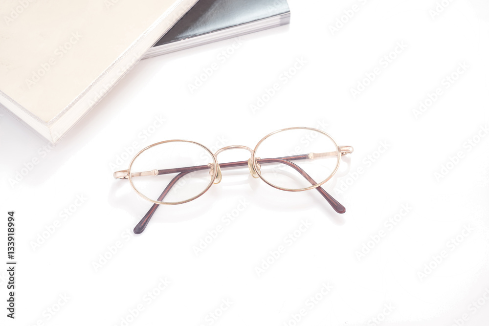 Eye glasses isolated with books