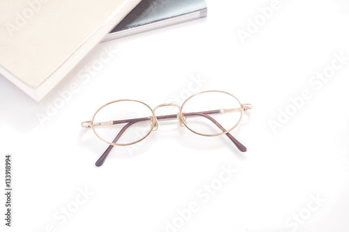 Eye glasses isolated with books