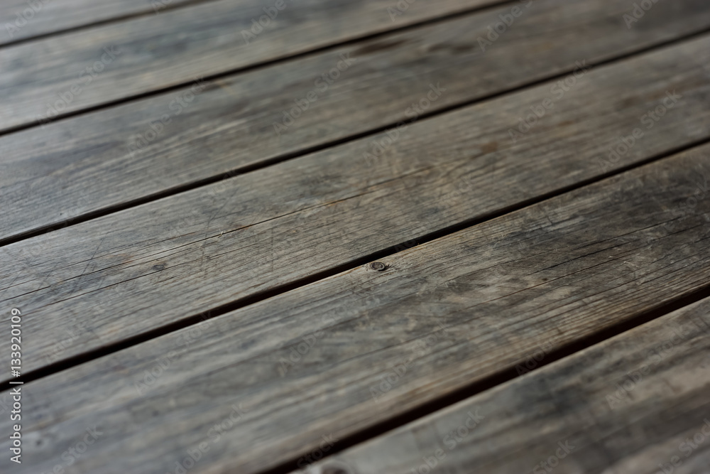 Dark wood plank texture background low depth of field