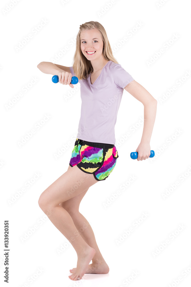 Blond woman in fitness wear exercising with the dumbbells on the white background Blond woman in fitness wear exercising with the dumbbells on the white background