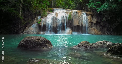 Pristine waterfall with pure clean water pond in tropical forest 4K nature video