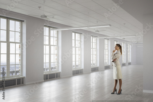 Businesswoman in her office . Mixed media