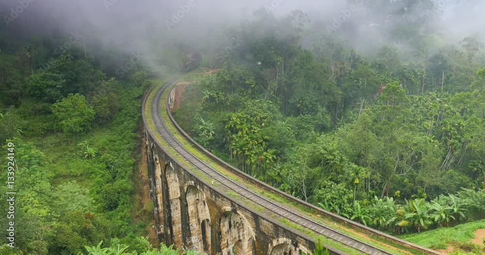 Old train crossing famous 9 Arches Bridge in Ella Sri Lanka. Travel landmark Old train crossing famous 9 Arches Bridge in Ella Sri Lanka. Travel landmark