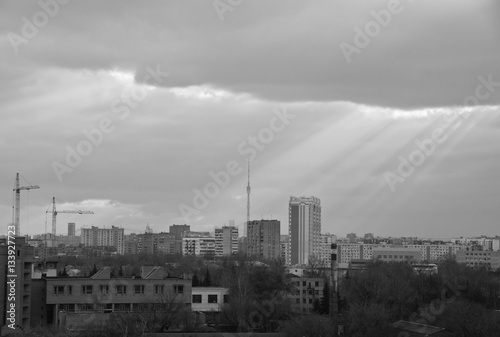 sunbeams breaking through massive clouds black and white