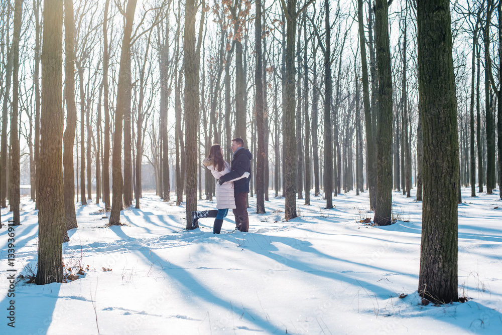 young loving couple having fun in snowy park
young loving couple having fun in snowy park