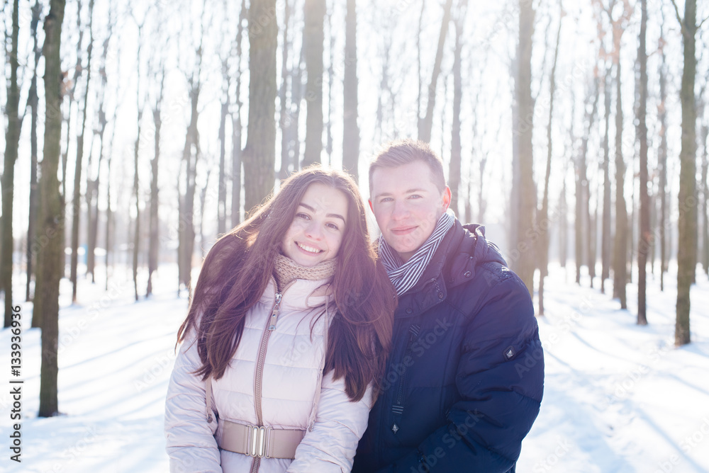 young loving couple having fun in snowy park
young loving couple having fun in snowy park