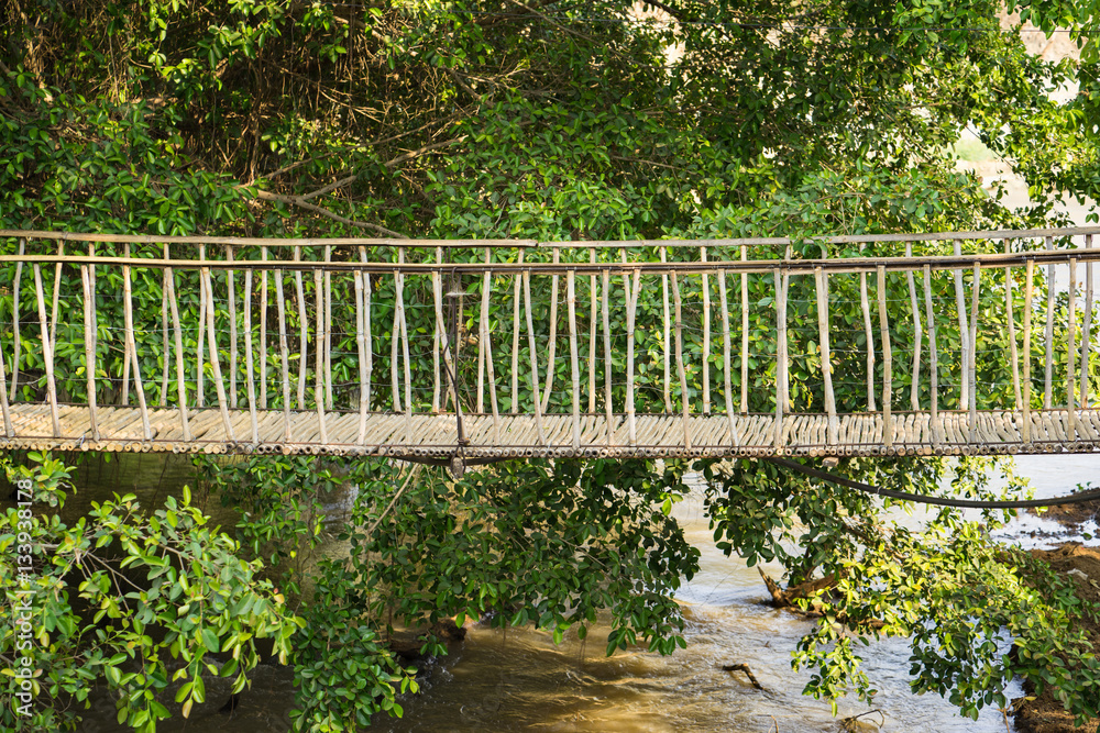 Walking suspense bridge made of dry bamboo in Tay Nguyen, central highlands of Vietnam, Asia