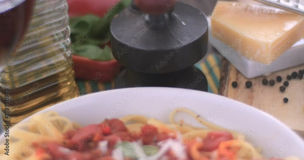 Dolly revealing view of Italian pasta (spaghetti, linguini) with tomato sauce Dolly revealing view of Italian pasta (spaghetti, linguini) with tomato sauce