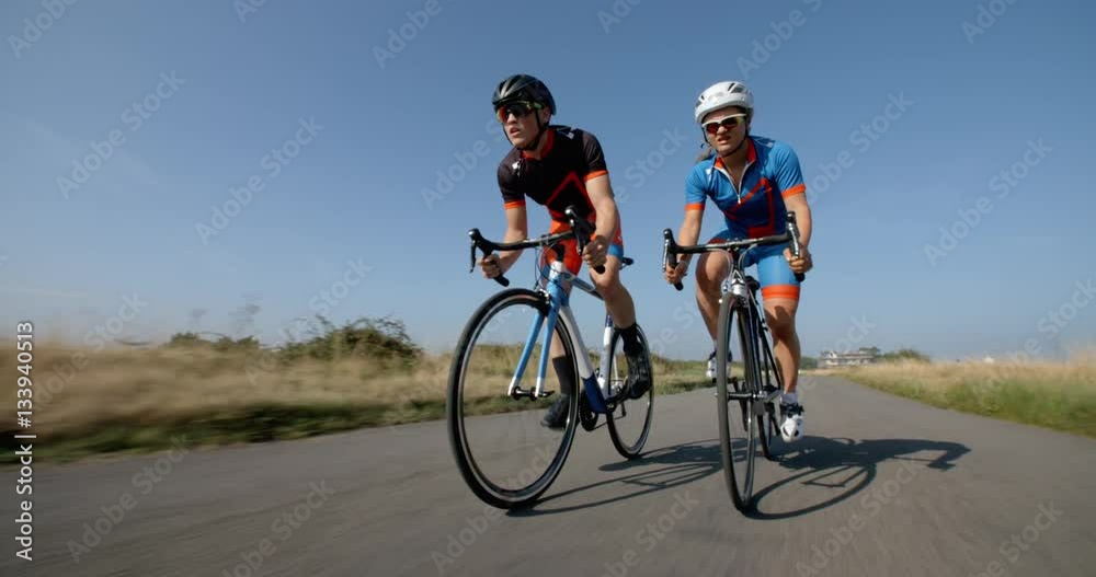 Male and Female Cyclists Ride Out Together. Male and Female Cyclists Ride Out Together.