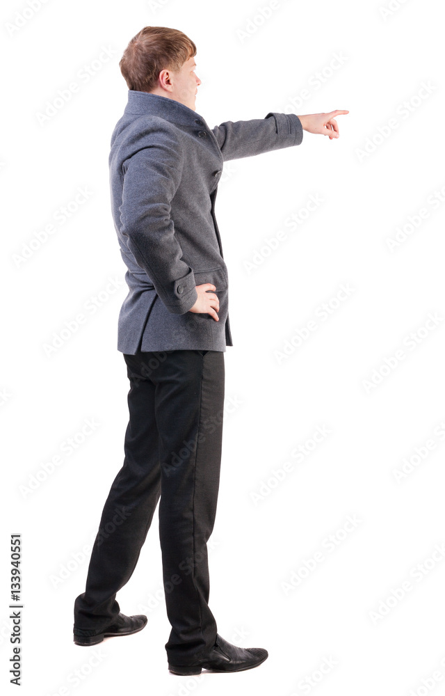 Back view of pointing young business men in coat Back view of pointing young business men in coat