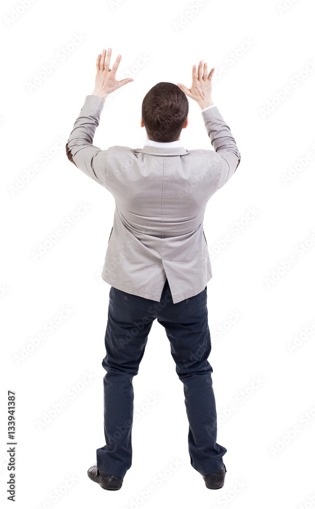 Businessman defends his hands on top of something. Businessman defends his hands on top of something.