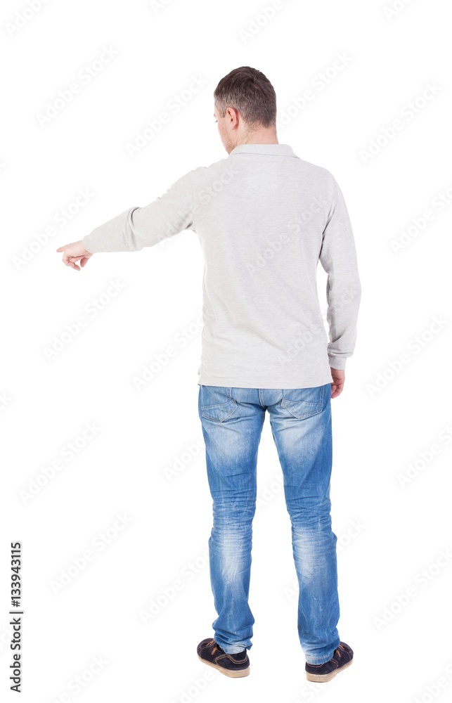 Back view of pointing young men in shirt and jeans. Back view of pointing young men in shirt and jeans.