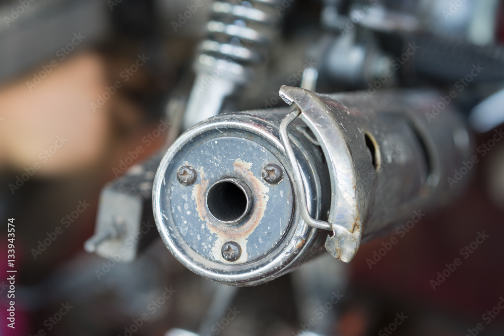 Closed up old motorcycle exhaust pipe Closed up old motorcycle exhaust pipe