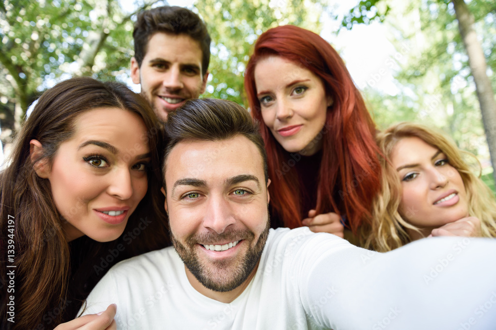 Group of friends taking selfie in urban background Group of friends taking selfie in urban background