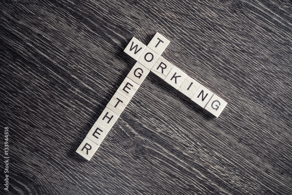 Conceptual business keywords on table with elements of game making crossword Conceptual business keywords on table with elements of game making crossword