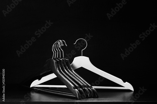 White hanger and a few black hangers, background, abstract