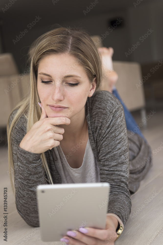 young women used tablet computer on the floor young women used tablet computer on the floor