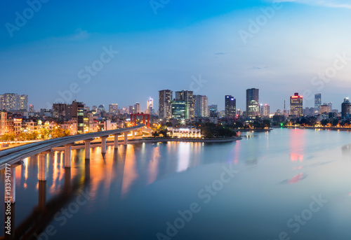 Aerial view of Hanoi cityscape by twilight period, with Dong Da lake and under construction Cat Linh - Ha Dong elevated railway © Hanoi Photography