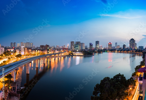Aerial view of Hanoi cityscape by twilight period  with Dong Da lake and under construction Cat Linh - Ha Dong elevated railway