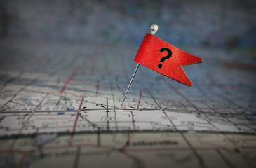 question mark flag on a map