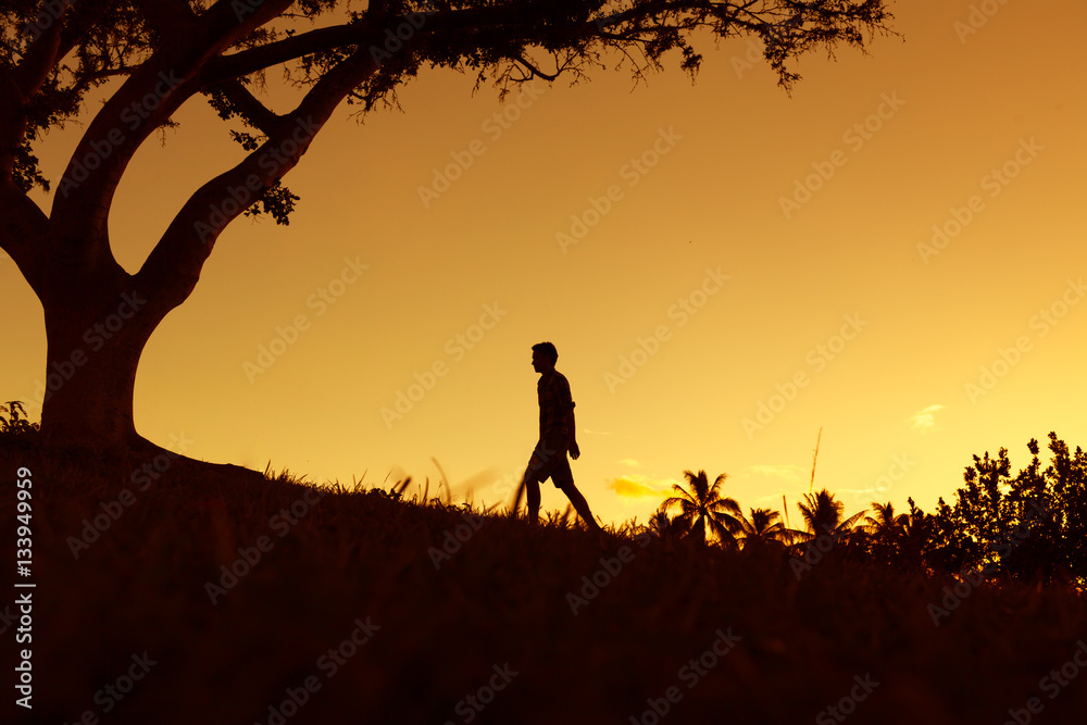 Thoughtful male walking alone out in nature. Thoughtful male walking alone out in nature.