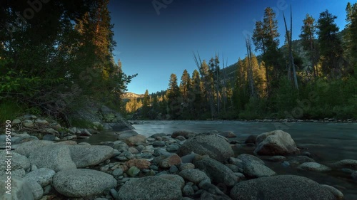 Day To Night - Remote river scene transitioning from sunset to night moonscape.