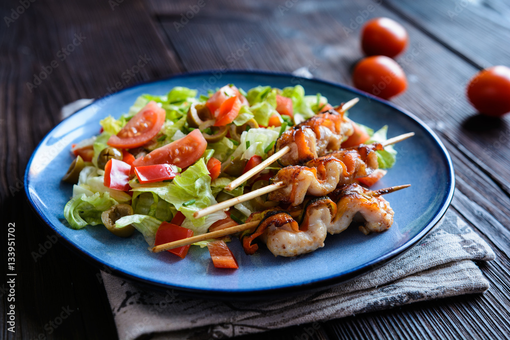 Chicken skewers with zucchini slices and vegetable salad Chicken skewers with zucchini slices and vegetable salad