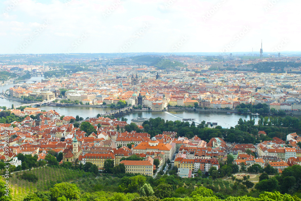 Beautiful View On Prague In Czech Republic With Flowing River Vltava And With Zizkov Television Tower In Background