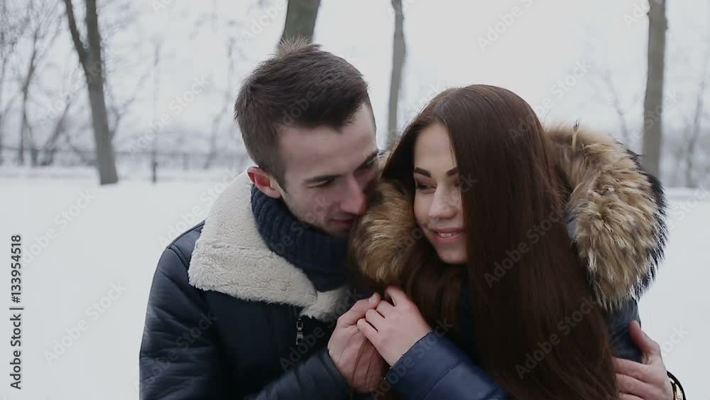 Guy and girl in winter in park Guy and girl in winter in park