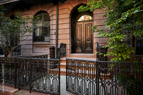a decorative brick brownstone building
