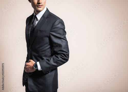 Man wearing suit and tie. 