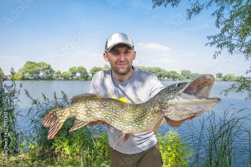 Fisherman with pike trophy