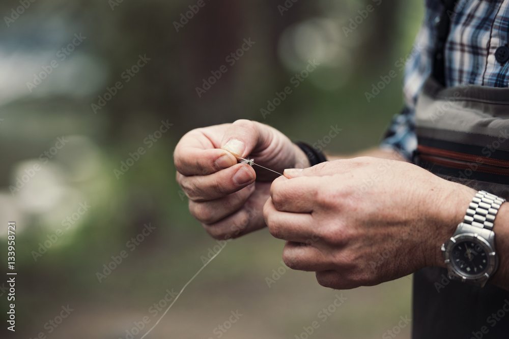 Close up of man holding fishing thread Close up of man holding fishing thread