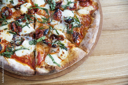 Close-up of pizza served on the table