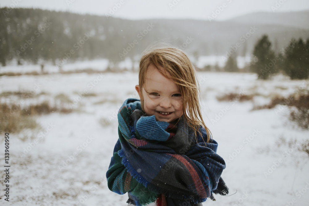 Portrait of happy girl wrapped in blanket during winter Portrait of happy girl wrapped in blanket during winter