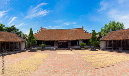 Front exterior view of Mong Phu communal house, a national relic in Duong Lam ancient village, Son Tay district, Hanoi, Vietnam.