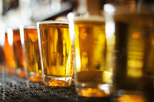 Row of beer glasses on table