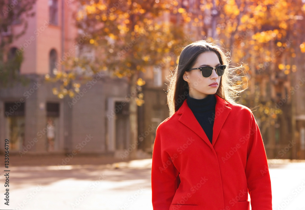 Beautiful young woman wearing sunglasses on autumn day Beautiful young woman wearing sunglasses on autumn day