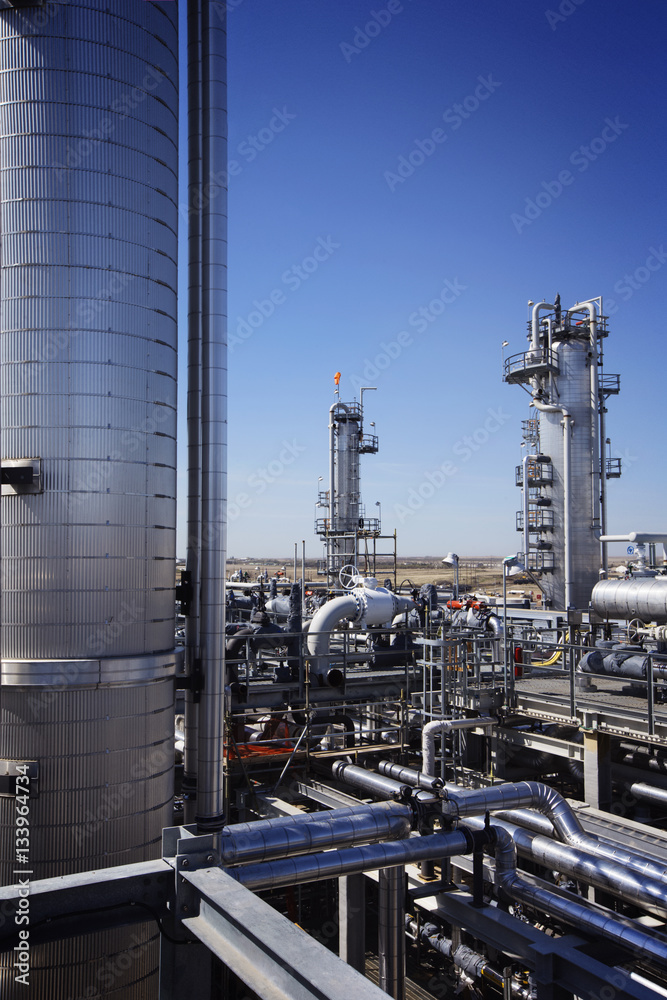 Power station against clear blue sky