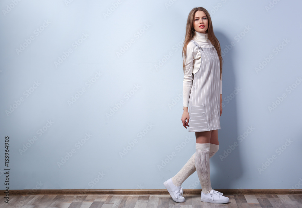Beautiful young woman on color wall background Beautiful young woman on color wall background