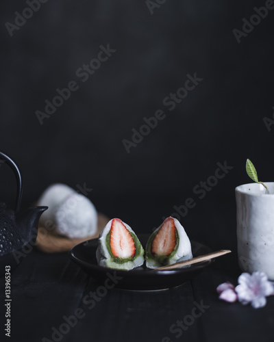 Strawberry Daifuku served in plate on table photo