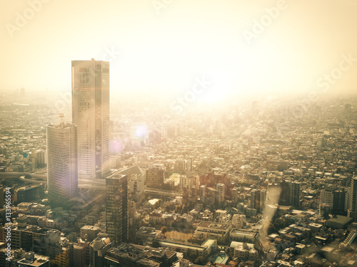 Canvas Print Warm glowing sun across Tokyo