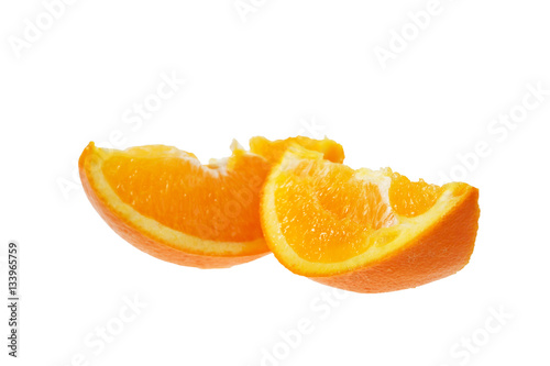 Ripe slice of orange on a white background