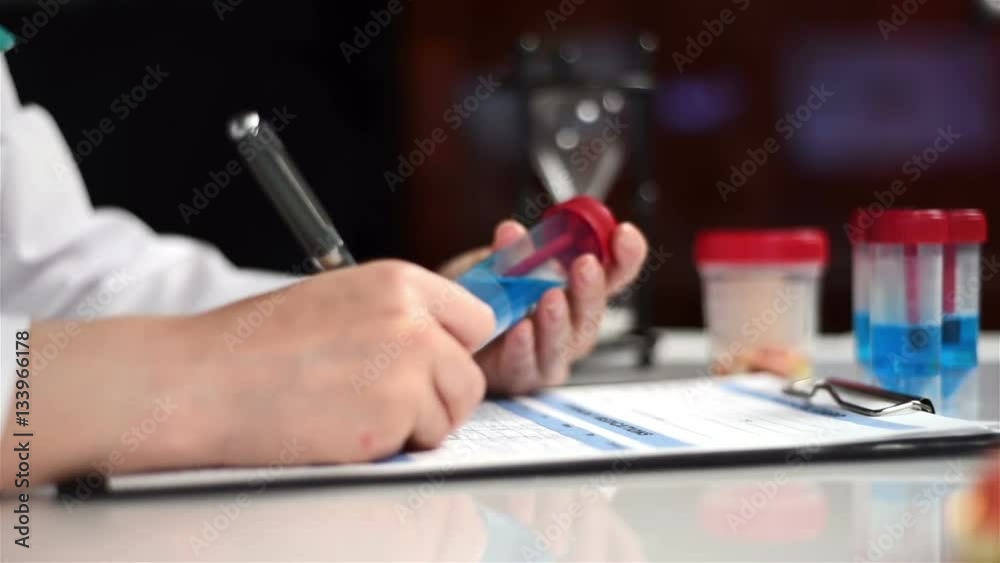 Scientist Woman Studying And Marker Blue Sample. Close Up Scientist Woman Studying And Marker Blue Sample. Close Up