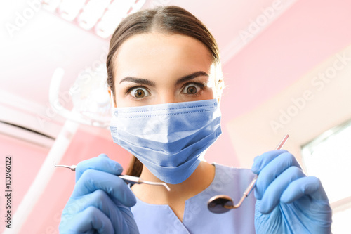 Dentist with mirror and per...
